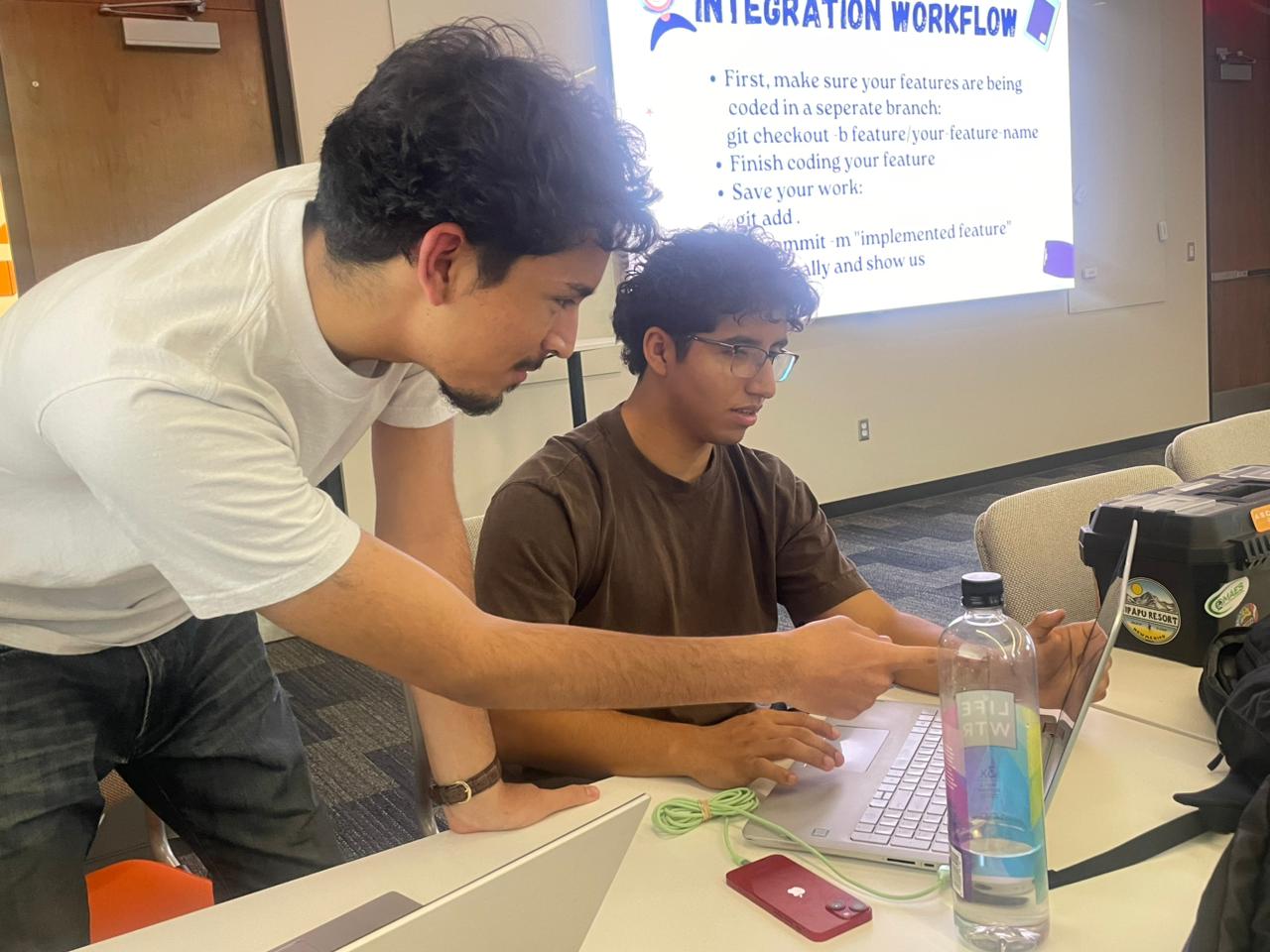 Tech Dev members collaborating on software